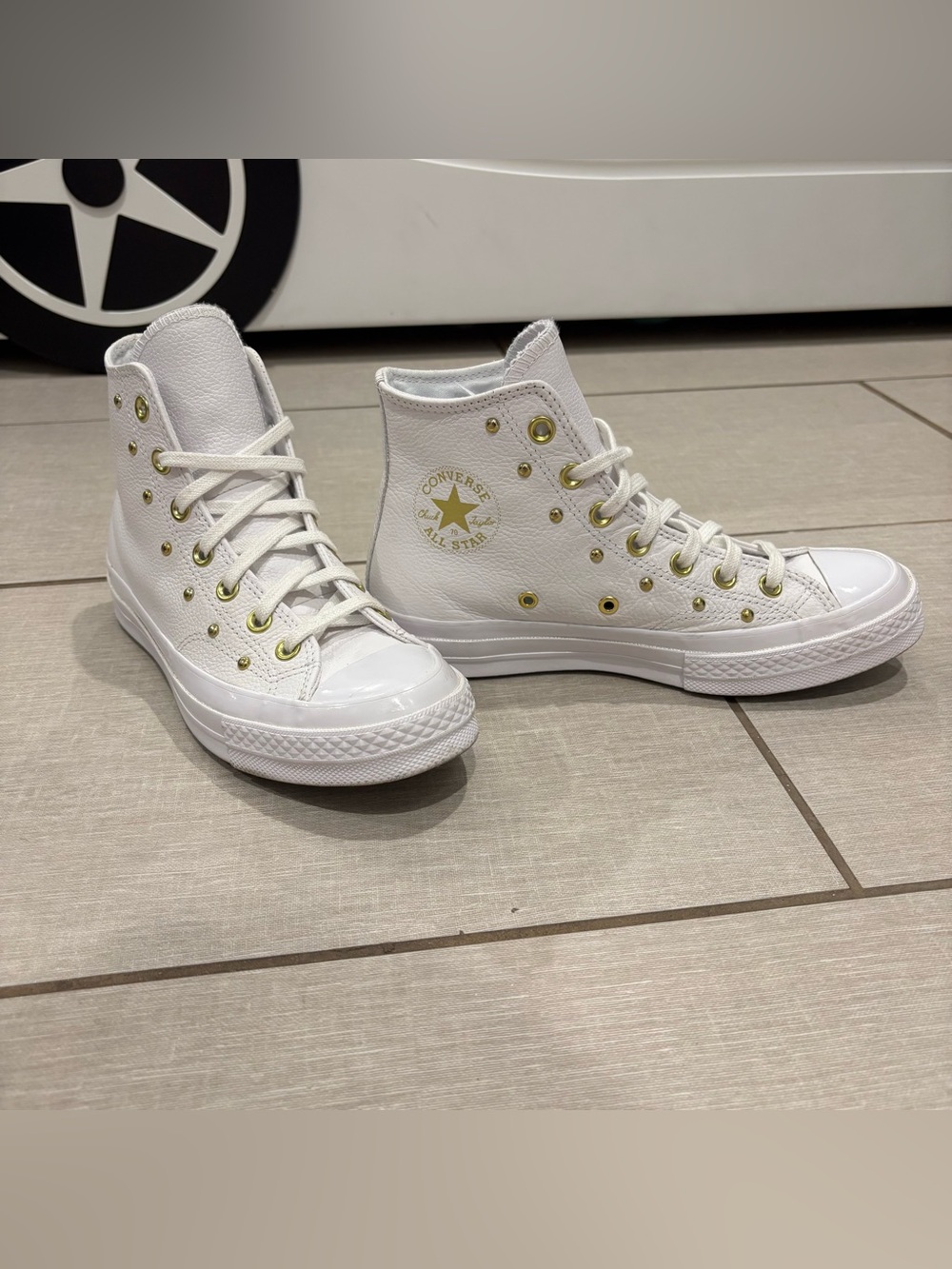 Converse White High-Top Sneakers with Gold Eyelets